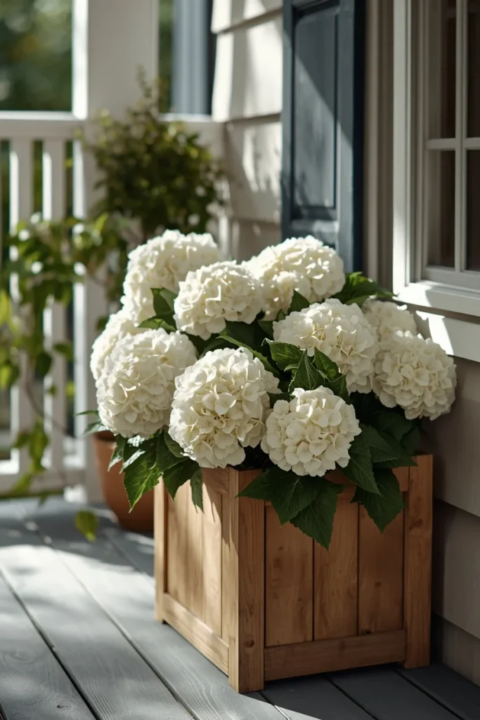 22 Front Porch Flower Ideas That Make Your Home's Entrance Bloom Beautifully 20 wooden planter box filled with realistic faux white hydrangeas
