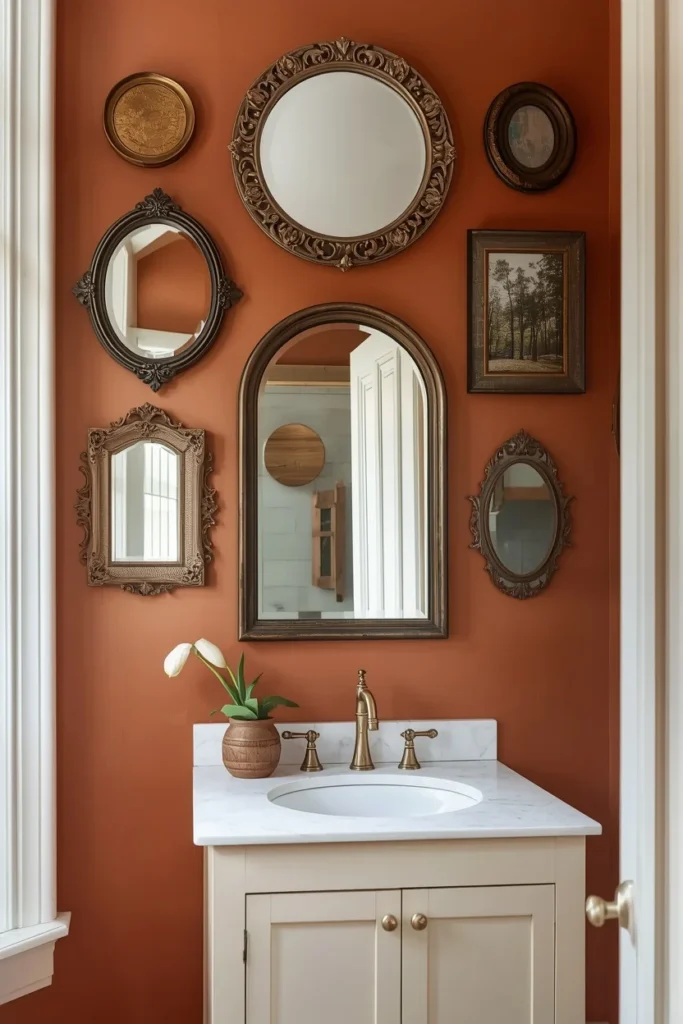 20 Farmhouse Bathroom Ideas That Are Rustic, Cozy & Utterly Gorgeous 7 Farmhouse bathroom accent wall covered in a curated gallery of seven mismatched vintage mirrors