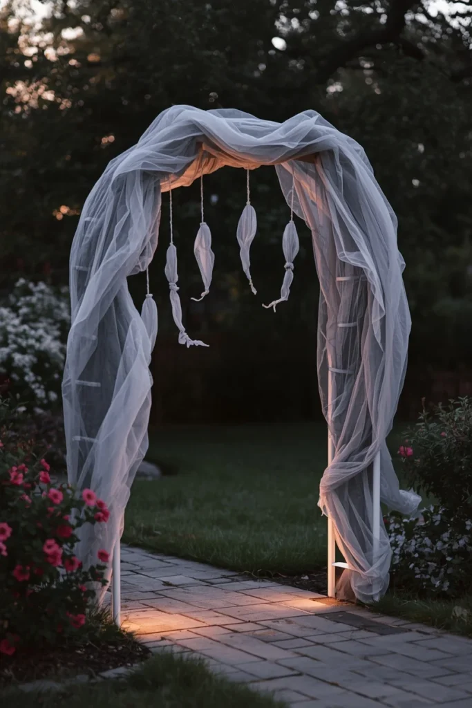 18 DIY Halloween Archway Ideas That Wow Trick-or-Treaters 14 front yard archway, featuring a simple curved PVC frame