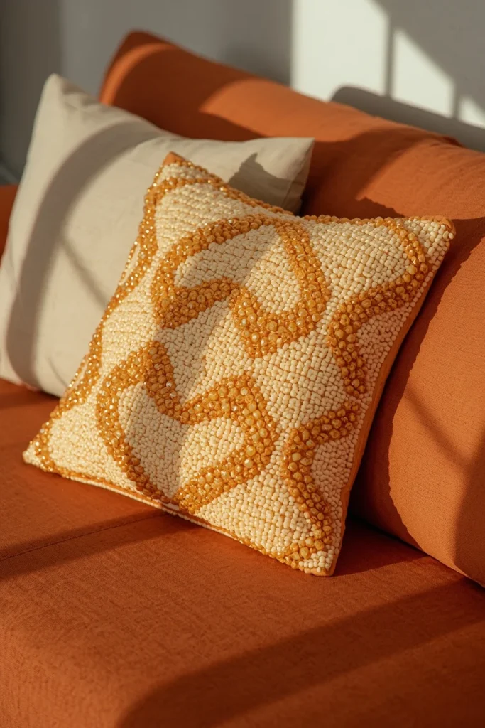  close-up styling shot, featuring one beaded geometric-pattern cushion