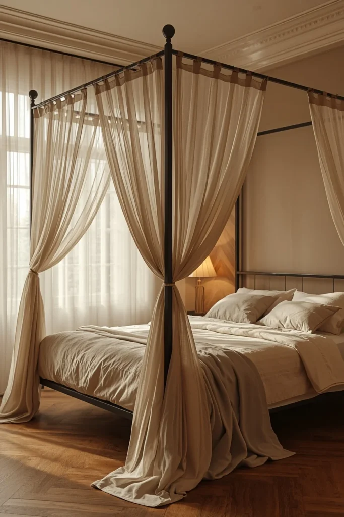22 Beautiful Bedroom Ideas That Turn Your Room Into a Personal Sanctuary 7 bedroom, featuring a slim black metal canopy bed frame with sheer cream linen curtains