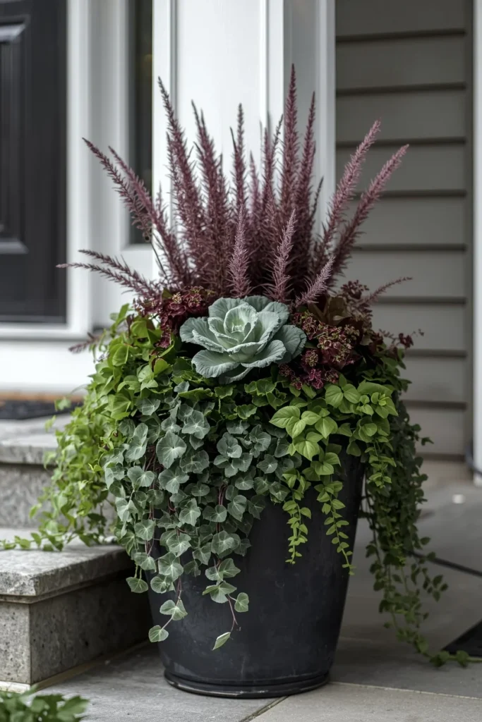 23 Fall Front Porch Decor Ideas Neighbors Will Envy 11 front porch planter, featuring layered ornamental kale, purple fountain grass, and trailing vines