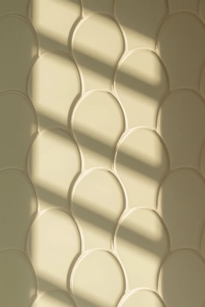 18 Scalloped Tile Ideas for a Soft, Statement-Making Bathroom 11 bathroom accent wall detail shot, featuring reverse-direction scalloped tile