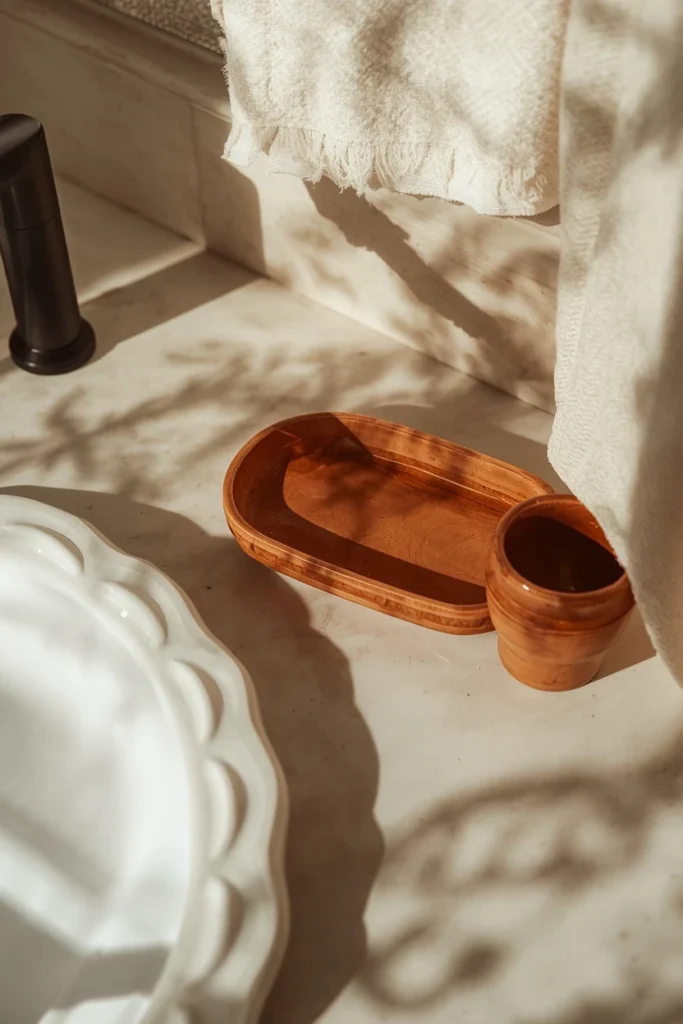 15 Fall Bathroom Decor Ideas for a Cozy Season Refresh 12 bathroom counter, featuring a hand-glazed stoneware soap dish and matching tumbler