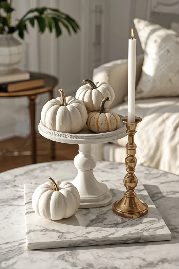 15 Fall Tray Decor Ideas to Style Your Coffee Table Like a Pro 14 coffee table, featuring a raised pedestal bowl filled with white pumpkins