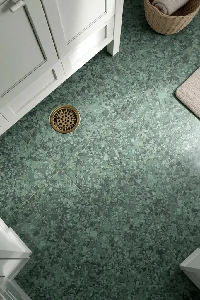 21 Green Bathroom Ideas That Bring Nature's Calm Into Your Home 14 bathroom floor close-up, featuring green-flecked terrazzo tile flooring,