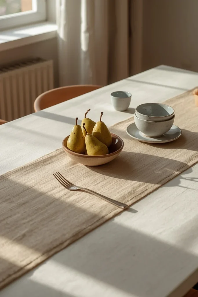 17 Understated Fall Decor Ideas for a Minimal, Modern Home 16 dining table shot, featuring a warm oatmeal linen table runner