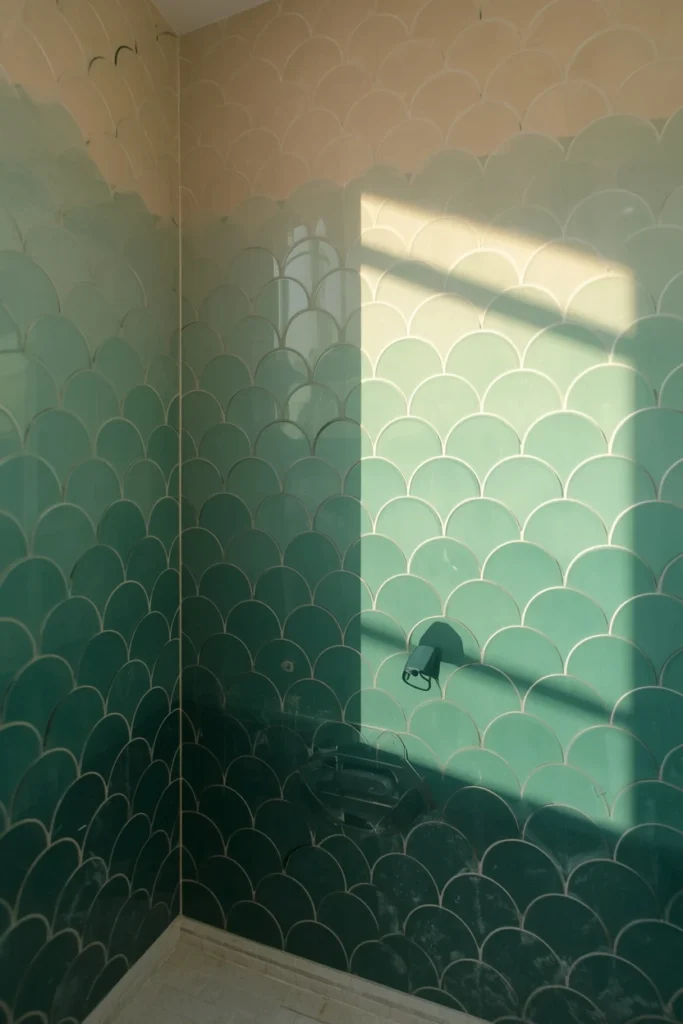 18 Scalloped Tile Ideas for a Soft, Statement-Making Bathroom 3 bathroom shower wall shot, featuring an ombre scalloped tile wall transitioning