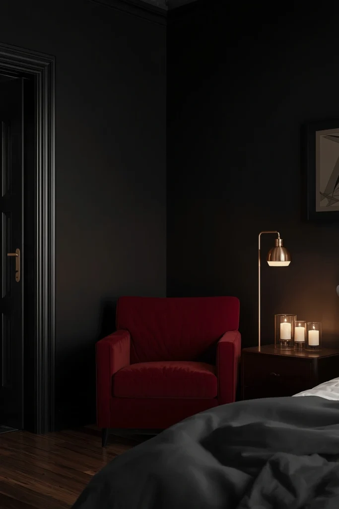 21 Vampy Romantic Bedroom Ideas for a Moody, Gothic-Chic Retreat 3 bedroom shot, featuring matte black painted walls, a velvet crimson accent chair