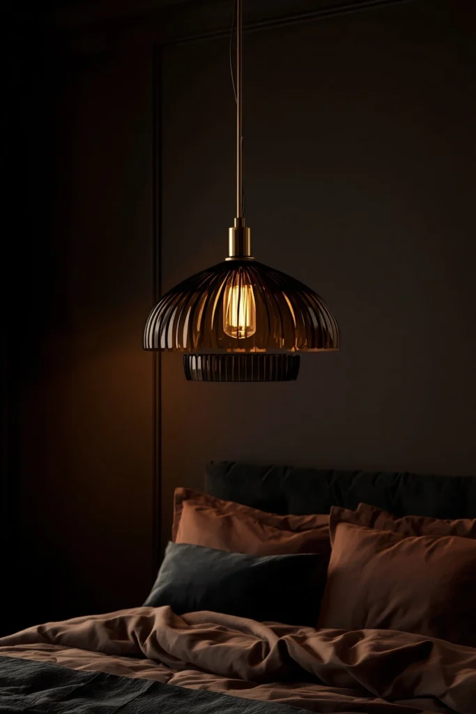  bedroom, featuring a sculptural smoked glass and brass pendant light fixture