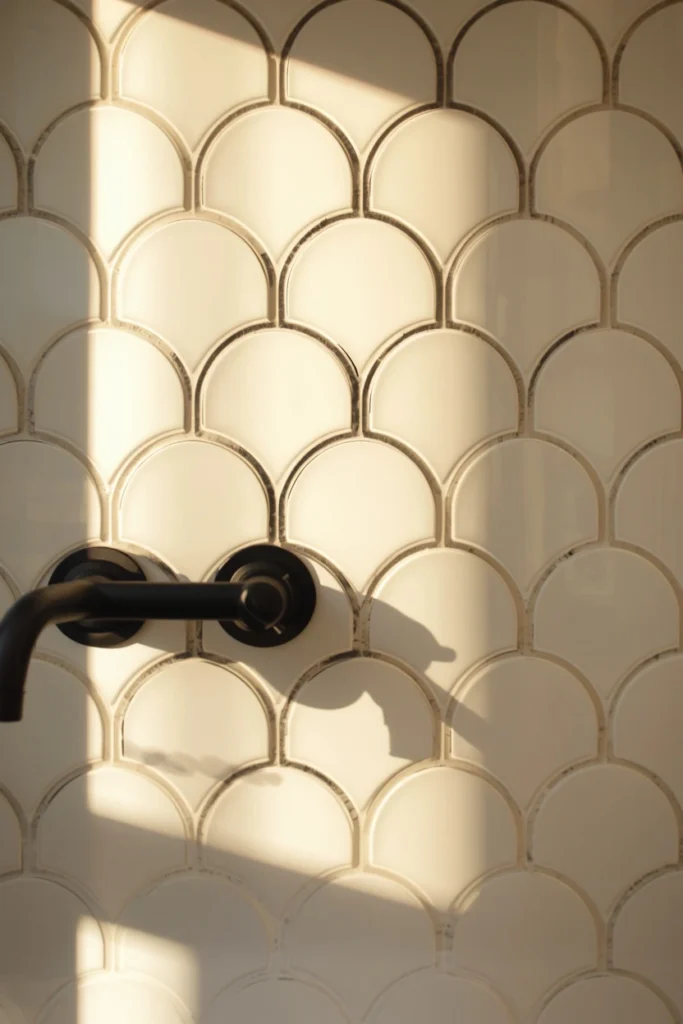18 Scalloped Tile Ideas for a Soft, Statement-Making Bathroom 7 bathroom wall shot, featuring white scalloped tile with bold black grout lines