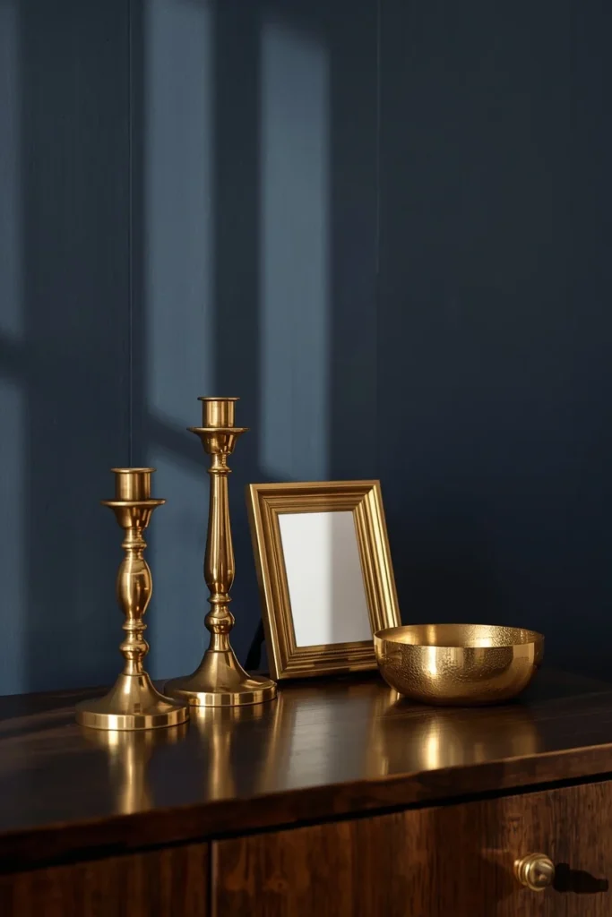 22 Cosmic Interior Design Ideas for a Starry, Galaxy-Inspired Home 10 console table styling shot, featuring brass candle holders, a small brass picture frame,